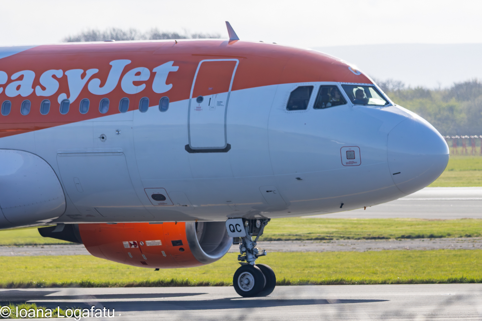 Airplane preparing for takeoff under bright skies